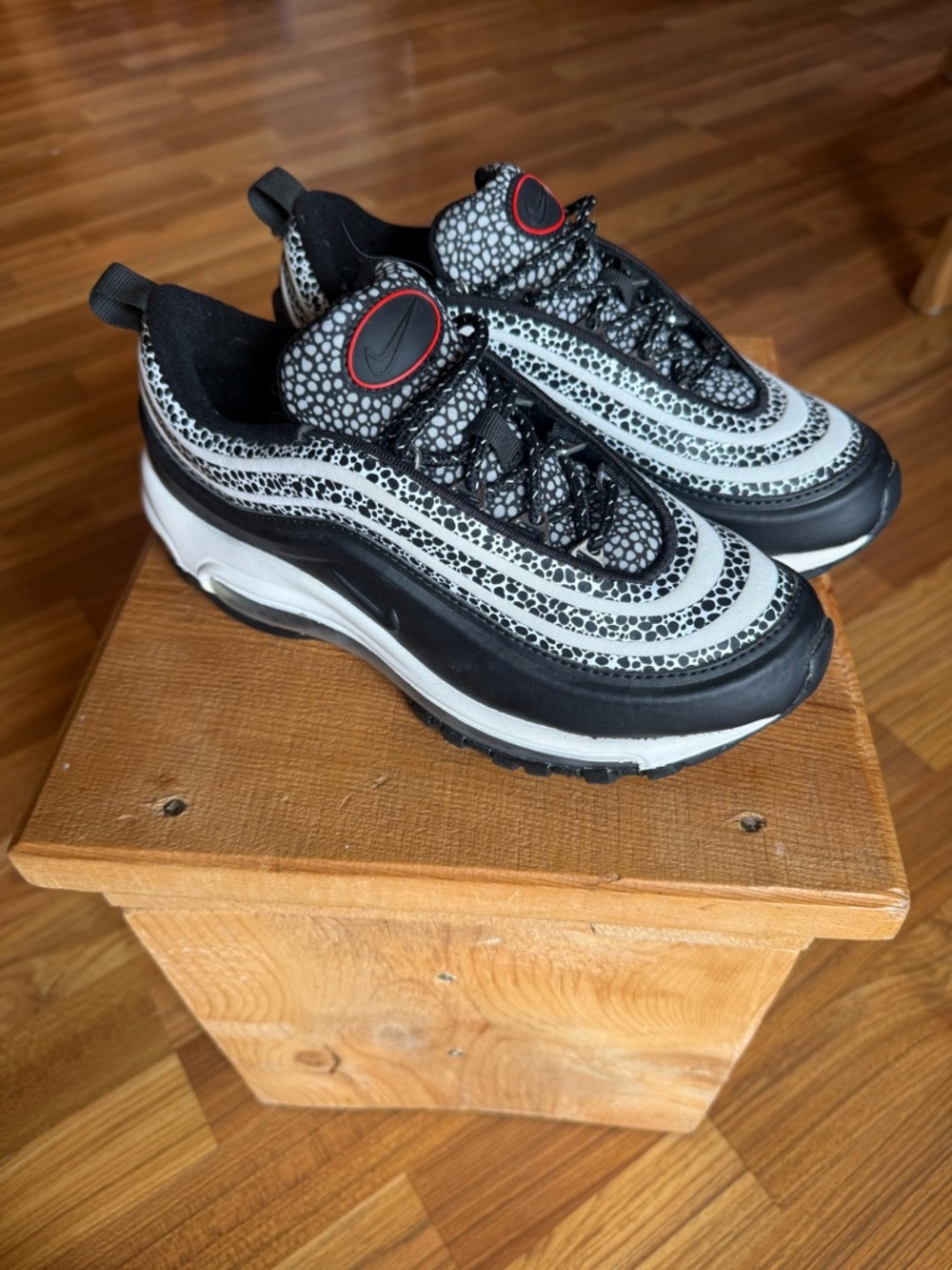 Nike Black and White Sneakers with Red Logo Accent